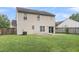 Fenced backyard featuring a grassy lawn and patio area, ideal for outdoor relaxation and entertaining at 125 Towering Pine Dr, Ladson, SC 29456
