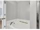 Bathtub in a bathroom with white walls and a wooden tray for a serene bathing experience at 125 Towering Pine Dr, Ladson, SC 29456