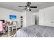 Spacious bedroom with ceiling fan, desk, and modern media for comfortable living and working at 125 Towering Pine Dr, Ladson, SC 29456