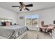 Comfortable bedroom with large window, ceiling fan, providing natural light and airflow at 125 Towering Pine Dr, Ladson, SC 29456