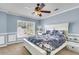Bedroom with a large window, a ceiling fan, and painted in light blue for a tranquil ambiance at 125 Towering Pine Dr, Ladson, SC 29456