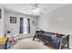 Cozy bedroom with carpet, a ceiling fan and a large window at 125 Towering Pine Dr, Ladson, SC 29456