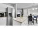 Bright open kitchen with stainless steel refrigerator and center island near breakfast area at 125 Towering Pine Dr, Ladson, SC 29456