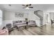 Spacious living room with a staircase, wainscoting, and cozy furniture at 125 Towering Pine Dr, Ladson, SC 29456