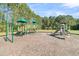 Community playground with a variety of colorful climbing structures and slides for to explore at 125 Towering Pine Dr, Ladson, SC 29456