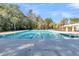 Full view of a sparkling community pool surrounded by palm trees and comfortable seating, perfect for relaxation at 125 Towering Pine Dr, Ladson, SC 29456