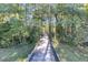 Inviting wooden walkway through a beautiful forest setting offers a tranquil and scenic path at 125 Towering Pine Dr, Ladson, SC 29456