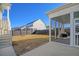 A spacious backyard features a screened porch, lush lawn and a privacy fence surrounding the perimeter at 128 Sandy Bend Ln, Summerville, SC 29486