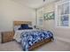 Inviting bedroom features a comfortable bed, rustic wood furniture and a bright sunny window at 128 Sandy Bend Ln, Summerville, SC 29486
