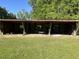 Open-air structure in the backyard, potentially a barn or shed, with ample space for storage at 1298 French Santee Rd, Jamestown, SC 29453