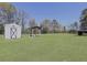 Expansive backyard featuring a utility shed and covered picnic area, perfect for outdoor activities at 1298 French Santee Rd, Jamestown, SC 29453