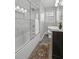 Charming bathroom with glass shower, dark vanity, and neutral-toned walls at 1298 French Santee Rd, Jamestown, SC 29453