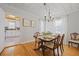 Inviting dining room featuring wooden floors, neutral walls, and ample natural light at 1298 French Santee Rd, Jamestown, SC 29453