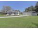 Charming one story home with a welcoming front porch and a large three car garage, set on a green lawn at 1298 French Santee Rd, Jamestown, SC 29453