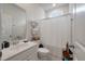 Clean bathroom with modern fixtures, ample storage, and a shower/tub combo, blending style with functionality at 143 Daniels Creek Cir, Goose Creek, SC 29445