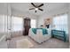 Charming bedroom with ample natural light, vintage furniture, and a bright, inviting atmosphere at 143 Daniels Creek Cir, Goose Creek, SC 29445