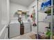 Well-organized laundry room with washer, dryer, shelving, and storage, perfect for efficient home management at 143 Daniels Creek Cir, Goose Creek, SC 29445