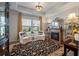 Cozy living room featuring a fireplace, tray ceiling, and neutral color palette at 143 Daniels Creek Cir, Goose Creek, SC 29445