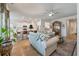 Cozy living room seamlessly connects to the kitchen with hardwood floors and a relaxed atmosphere at 143 Daniels Creek Cir, Goose Creek, SC 29445