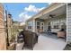 Outdoor patio space with wicker furniture, patio string lights, and an outdoor ceiling fan at 143 Daniels Creek Cir, Goose Creek, SC 29445