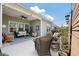 Relaxing covered patio with wicker furniture and view of the backyard at 143 Daniels Creek Cir, Goose Creek, SC 29445
