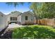 Charming backyard with manicured lawn, gravel area with outdoor seating and fire pit at 1430 E Montague Ave, North Charleston, SC 29405