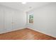 Bright, airy bedroom with hardwood flooring, natural light, and ample space to accommodate furniture at 1430 E Montague Ave, North Charleston, SC 29405