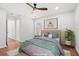 Bedroom features hardwood floors, a ceiling fan, and a window at 1430 E Montague Ave, North Charleston, SC 29405