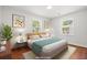 Inviting bedroom with modern decor, large windows, and soft, neutral tones for relaxation at 1430 E Montague Ave, North Charleston, SC 29405