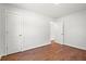Spacious bedroom with hardwood floors, neutral walls, and ample space for furniture arrangement at 1430 E Montague Ave, North Charleston, SC 29405