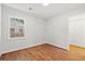 Sunny bedroom featuring hardwood floors, a window with a view, and a spacious closet for storage at 1430 E Montague Ave, North Charleston, SC 29405