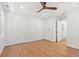 Spacious bedroom featuring hardwood floors, a ceiling fan, and multiple closets at 1430 E Montague Ave, North Charleston, SC 29405