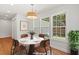 Bright breakfast nook featuring a round table, modern light fixture and many windows at 1430 E Montague Ave, North Charleston, SC 29405