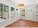 Bright breakfast nook featuring hardwood floors, outdoor access and many windows at 1430 E Montague Ave, North Charleston, SC 29405