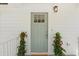 Inviting entryway features a green front door and flowering plants at 1430 E Montague Ave, North Charleston, SC 29405