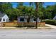 Charming home boasts a modern fence and well-maintained landscaping at 1430 E Montague Ave, North Charleston, SC 29405