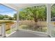 Inviting front porch featuring white railings, a cozy space, and a lovely view of the neighborhood at 1430 E Montague Ave, North Charleston, SC 29405