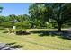 Lush green space with mature trees offers a peaceful setting for recreation and relaxation at 1430 E Montague Ave, North Charleston, SC 29405