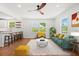 Open-concept living area with adjacent bar seating, abundant natural light, and modern decor at 1430 E Montague Ave, North Charleston, SC 29405