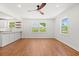 Open-concept space features hardwood floors, recessed lighting, and bar seating at the kitchen counter at 1430 E Montague Ave, North Charleston, SC 29405
