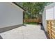 A side yard view with a gravel area between the house and garage at 1430 E Montague Ave, North Charleston, SC 29405
