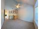 Bright bedroom with a vaulted ceiling, built in desk, and a large window with blinds at 15 Town Park Ln # A, Charleston, SC 29412