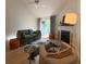 Comfortable living room with fireplace, modern decor, and a sliding glass door to the outside at 15 Town Park Ln # A, Charleston, SC 29412