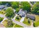 Aerial view shows the home's layout, landscaping, solar panels and its positioning in a tree-filled neighborhood at 1593 Westwood Dr, Charleston, SC 29412