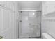 Modern bathroom with a glass-enclosed shower and sleek white tile at 1593 Westwood Dr, Charleston, SC 29412