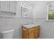 Clean bathroom features a marble-topped vanity, updated lighting, and a tiled wall at 1593 Westwood Dr, Charleston, SC 29412