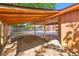 A large, covered carport with a rustic, open-beam ceiling, offering ample outdoor space and parking at 1593 Westwood Dr, Charleston, SC 29412