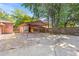 Large carport and additional parking pad behind the home, with mature trees at 1593 Westwood Dr, Charleston, SC 29412