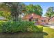 Inviting home with mature landscaping and solar panels on roof at 1593 Westwood Dr, Charleston, SC 29412