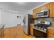 Well-equipped kitchen with stainless steel appliances and adjoining dining area at 1593 Westwood Dr, Charleston, SC 29412